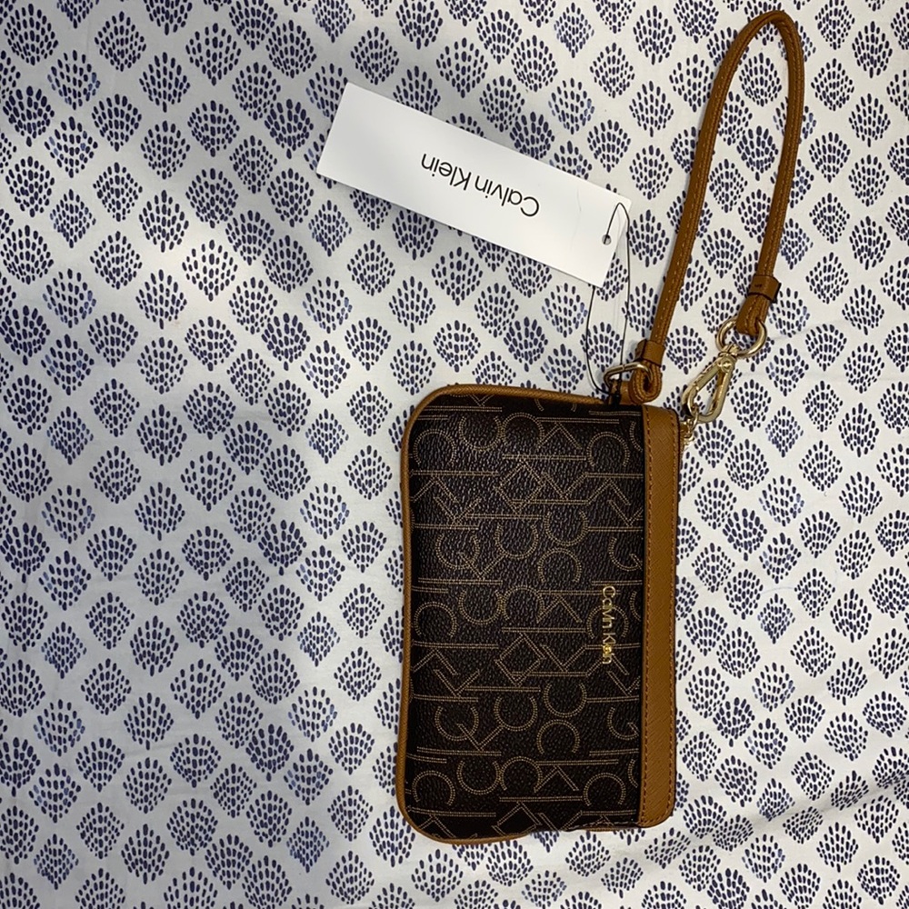Brand new authentic Calvin Klein wristlet.